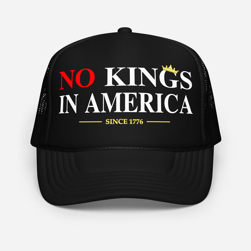Front of No Kings In America black foam trucker hat showing large script design printed in red and white font.