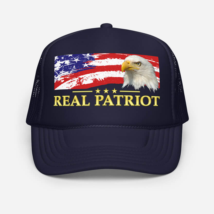 Front of Real Patriot USA Flag Eagle navy trucker hat showing printed flag & eagle design. Real Patriot in gold-colored font.