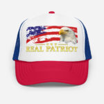 Front of Real Patriot USA Flag Eagle red, blue trucker hat with white front showing printed flag, eagle, Real Patriot design.